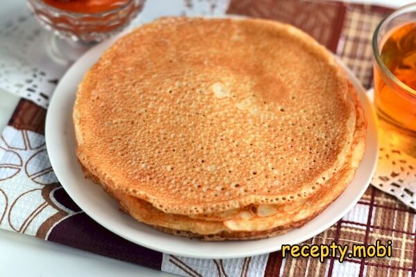 Yeast pancakes on milk with holes