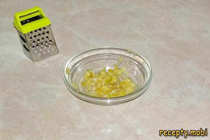 We pass a clove of garlic through a press or three on a fine grater - photo step 3