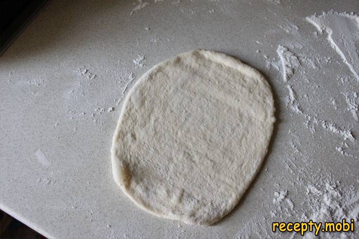 Roll out the base into an oval layer - photo step 5