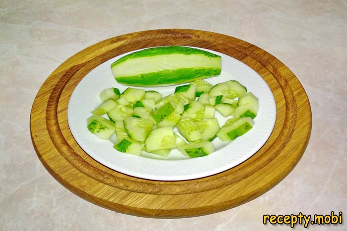 Partially remove the peel from the cucumber - photo step 3