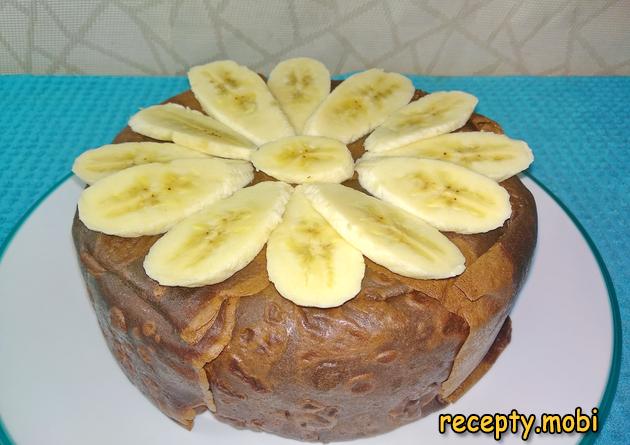 Chocolate pancake cake with custard and bananas