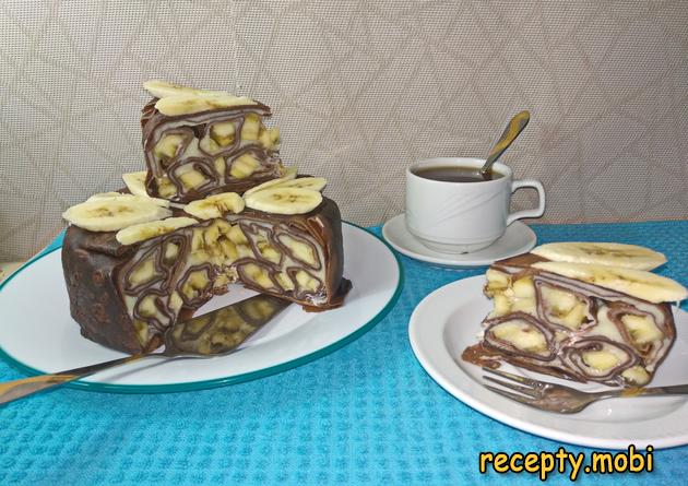Chocolate pancake cake with custard and bananas