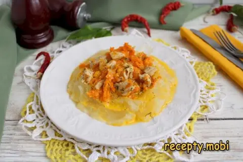 Pork with onions and carrots in a skillet