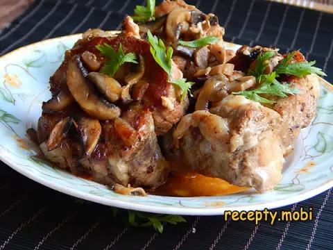 Pork Ribs with Mushrooms in a Skillet